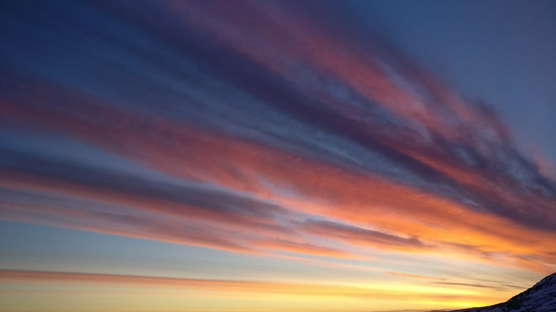 Rainbow clouds illuminating the Arctic skies