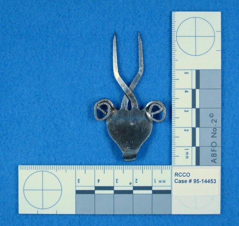 Goat pendant discovered at the crime scene