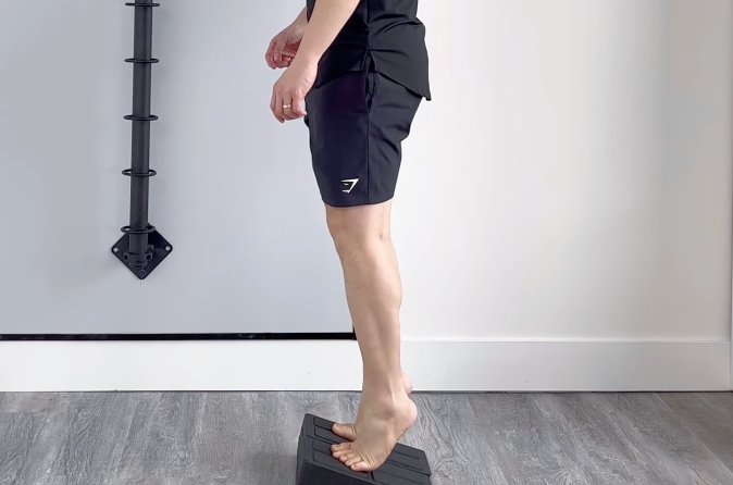 Calf raise exercise on slant board